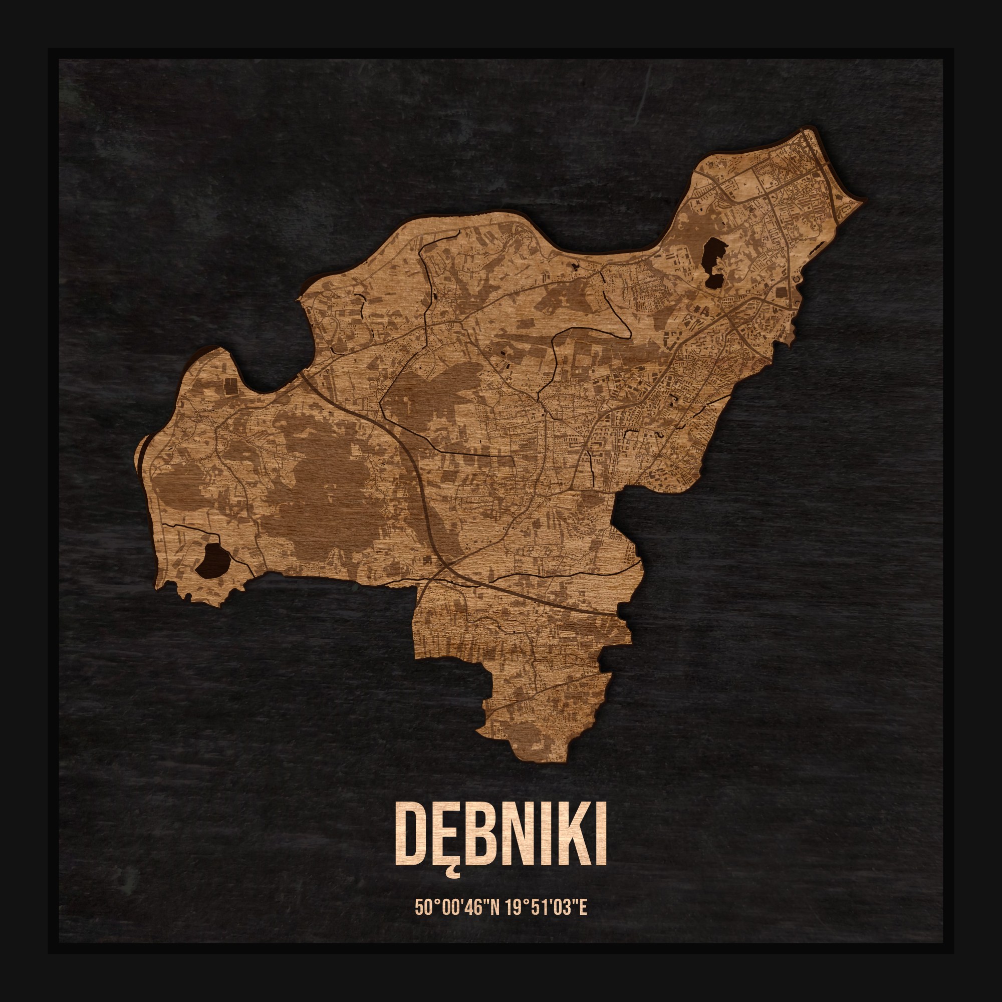Drewniana mapa dzielnicy Dębniki w ramce 25×25: kontur dzielnicy na czarnej płycie, ulice, budynki, zieleń i woda
