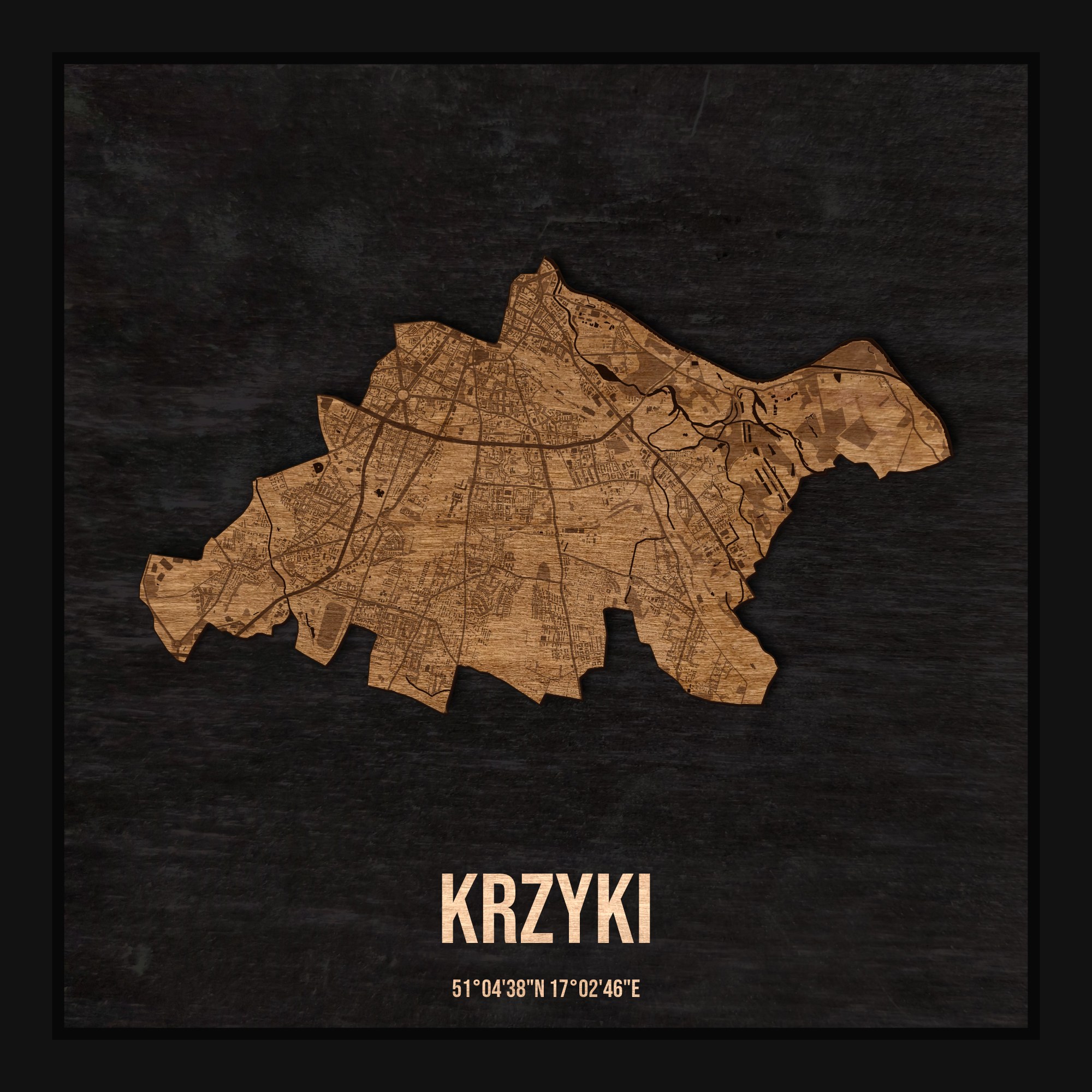 Drewniana mapa dzielnicy Krzyki w ramce 25×25: kontur dzielnicy na czarnej płycie, ulice, budynki, zieleń i woda