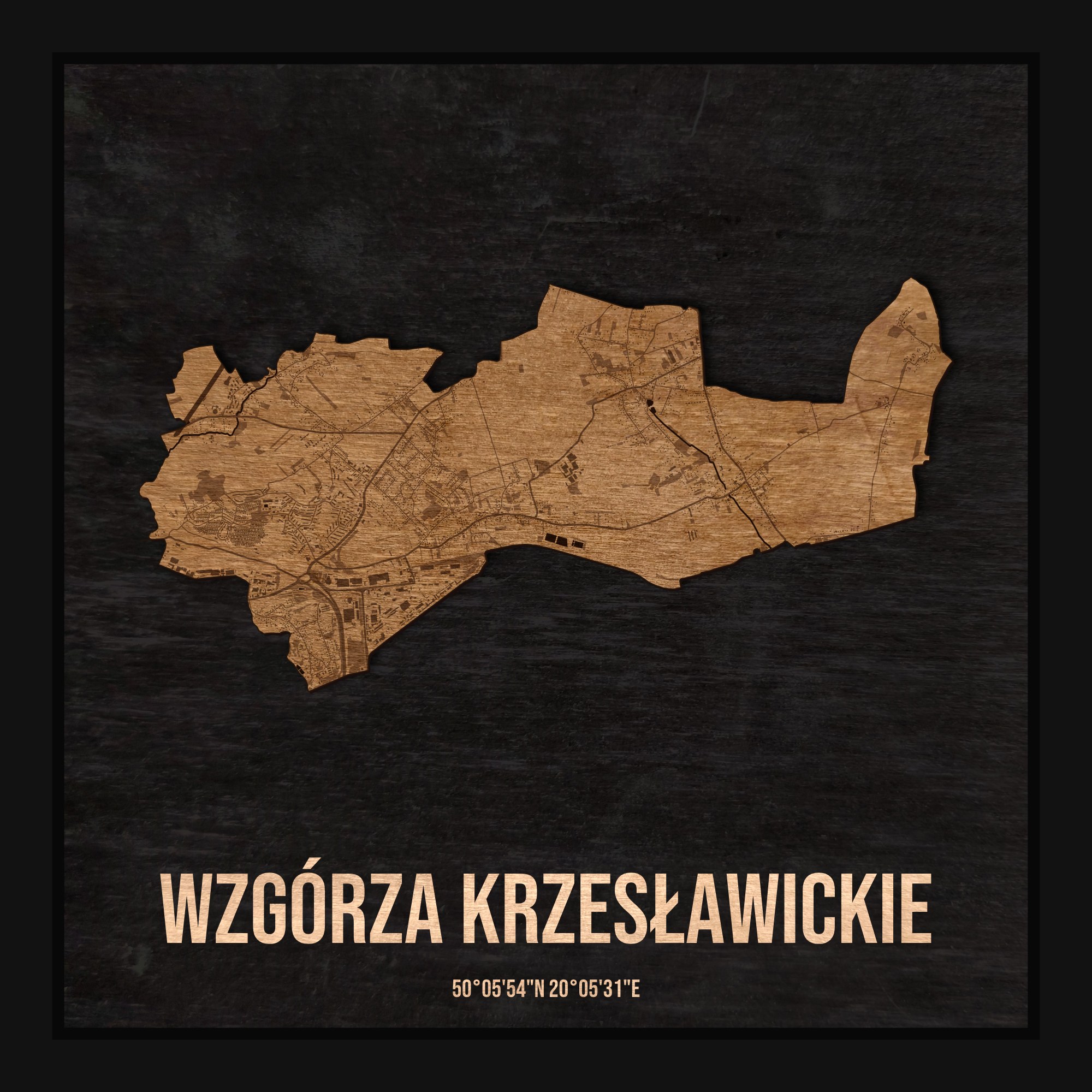 Drewniana mapa dzielnicy Wzgórza Krzesławickie w ramce 25×25: kontur dzielnicy na czarnej płycie, ulice, budynki, zieleń i woda